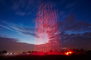 An even 100 drones took to the air over Tornesch, Germany, on the evening of Nov. 4, 2015, to create Drone 100. The elaborate marriage of music and light and flight was the result of months of effort by Intel Corp. engineers and Ars Electronica FutureLab digital artists. Their sky-filling artwork was accompanied by an orchestra on the ground and fully enabled by Intel-powered PCs. All their efforts were rewarded with a Guinness World Records citing for the “most unmanned aerial vehicles airborne simultaneously.” (Credit: Intel Corporation)