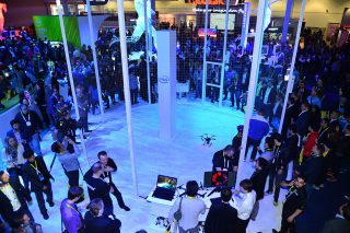 Unmanned aerial vehicles circle in a protected area of Intel’s display space. Built with Intel RealSense technology, the drones are able to avoid collisions. Intel CEO Brian Krzanich demonstrated the Yuneec Typhoon H with Intel RealSense technology during his keynote address at the International Consumer Electronics Show. The drones were on display Wednesday, Jan. 6, 2016, in Intel’s display area at the 2016 International Consumer Electronics Show. CES, the leading forum for the world’s consumer technology leaders, runs Jan. 5-9, 2016, in Las Vegas. (Credit: Intel Corp./Walden Kirsch)